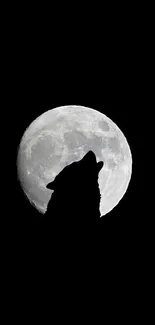 Silhouette of a wolf howling at the full moon.