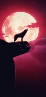 Silhouette of a wolf against a glowing red moon with dark clouds.