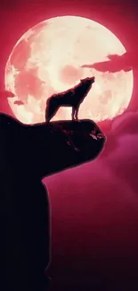 Silhouette of wolf howling atop cliff against red moon.