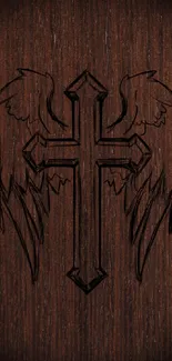 Wooden cross with wings on dark brown background wallpaper.