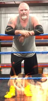 Wrestler standing in a ring with blue ropes in a gym setting.