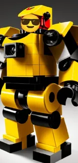 Yellow brick robot toy mobile wallpaper with bold colors and creative design.