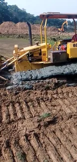 Bulldozer moving earth at a construction site.