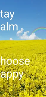 Yellow field and rainbow under clear blue sky, inspiring tranquility.