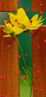 Yellow flower with red hearts on wood background.