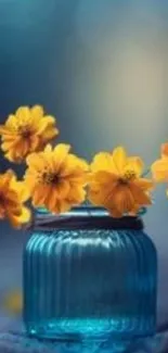 Yellow flowers in blue vase with soft background.