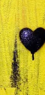 Yellow textured wallpaper with black heart graffiti.