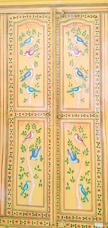 Hand-painted yellow wardrobe with birds and floral patterns.