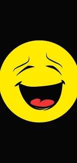 Bright yellow smiley face on black background wallpaper.