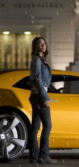 Yellow sports car in city backdrop at night.