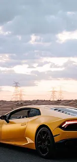 Yellow sports car driving through a desert landscape under a cloudy sky.