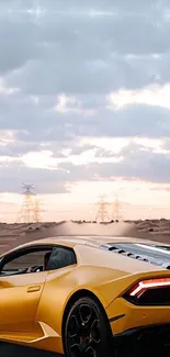 Yellow sports car parked in a desert under a cloudy sky.