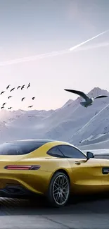 Yellow sports car on a mountain road with birds flying.