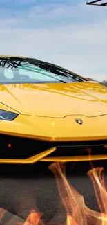 Yellow Lamborghini with flames in urban setting.