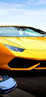 Yellow sports car parked on urban street with industrial background.