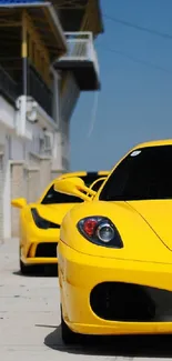 Yellow sports car parked on a race track.