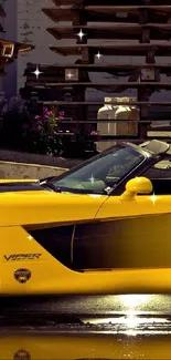 Yellow sports car parked outdoors, reflecting in water.