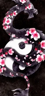 Yin yang dragon with cherry blossoms on a dark background.