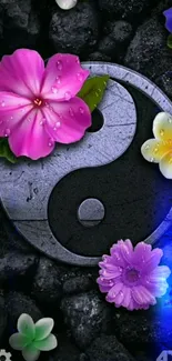 Yin Yang symbol with vibrant flowers and stones on a mobile wallpaper.