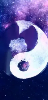 Yin Yang symbol against a galaxy background in purple hues.