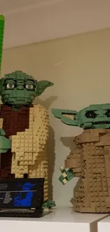 LEGO models of Yoda and Baby Yoda on a display shelf.