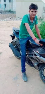 Young man with black motorcycle in urban setting