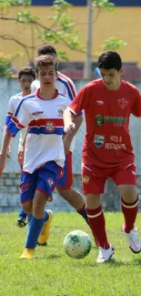 Youth soccer players in action on green field.