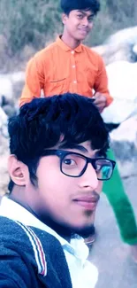 Outdoor selfie wallpaper of young friends with blue and orange tones.