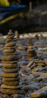 Stack of smooth pebbles on a rocky beach, creating a tranquil scene.