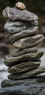 Zen stack of stones set against a soothing, natural background.